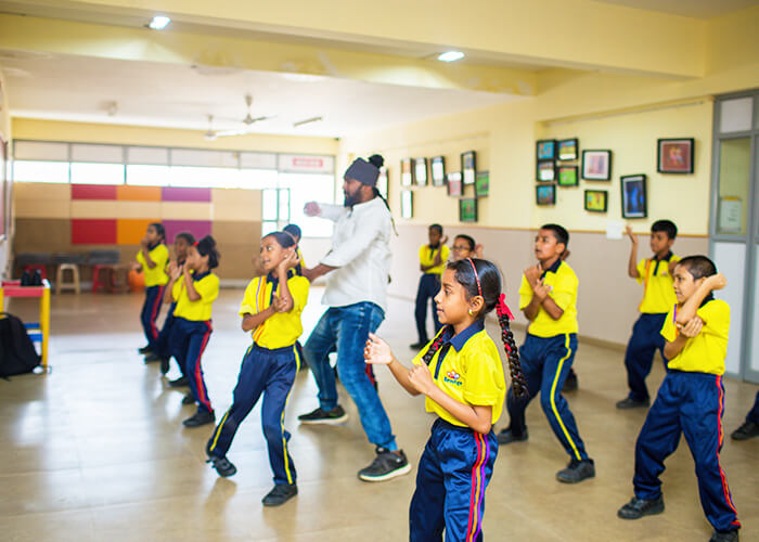 Children enjoying an interactive classroom learning session at NewAge World School
