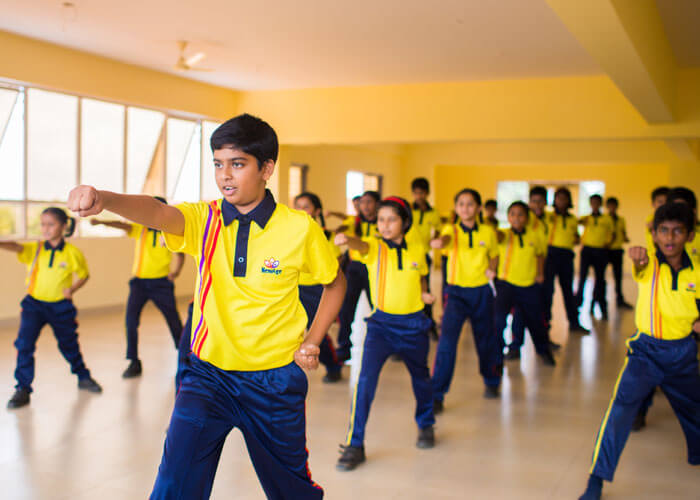 Students practicing martial arts to build discipline and confidence at NewAge World School.